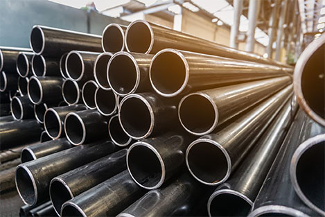 High-performance steel tubing stacked and ready for industrial use